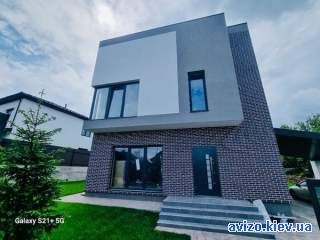 Продам 2 єт. новій кирпичній дом 200 кв.м. в с.Лесники с ремонтом